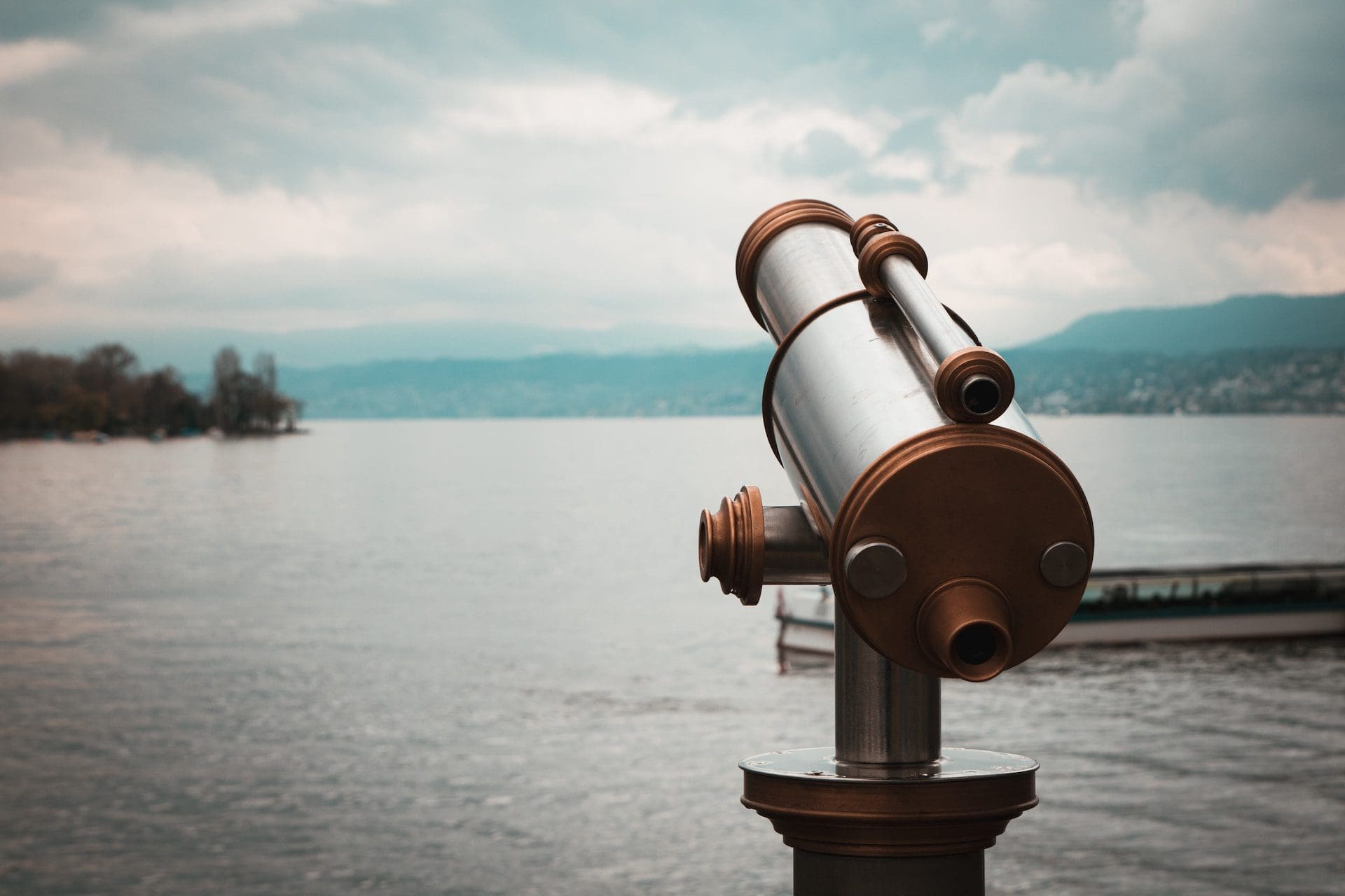 a picture of a telescope looking over a lake representing search