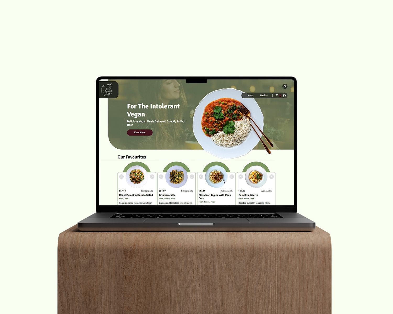 Passel Foods website shown on macbook on a wood plinth